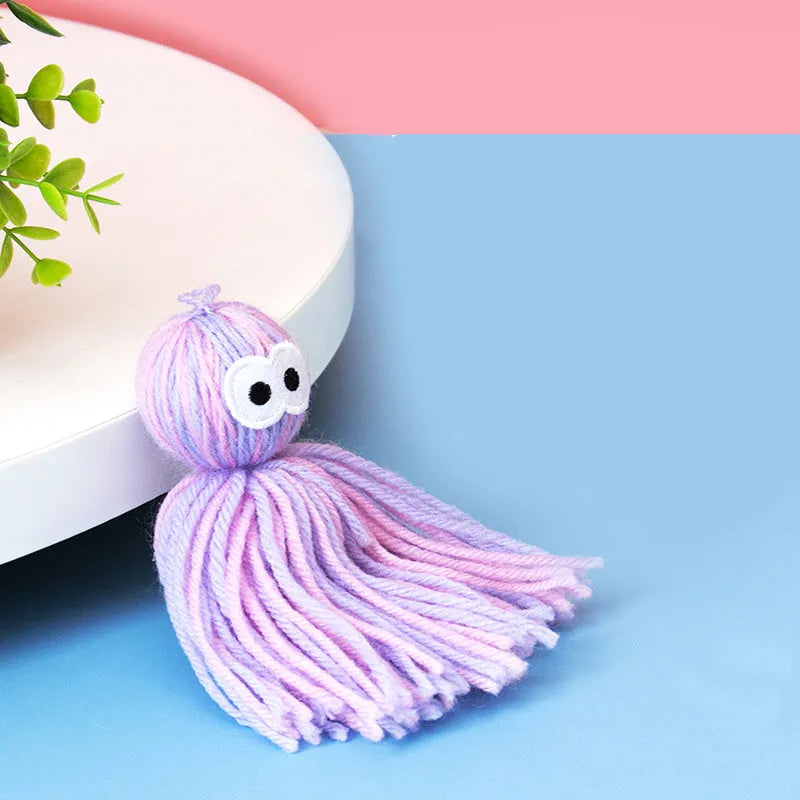Wool ball cat toy hanging with blue grey colour and 10cm dimensions for teeth grinding play