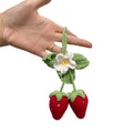 Handmade strawberry-shaped weaving pendant for car decoration made of cotton and hemp.