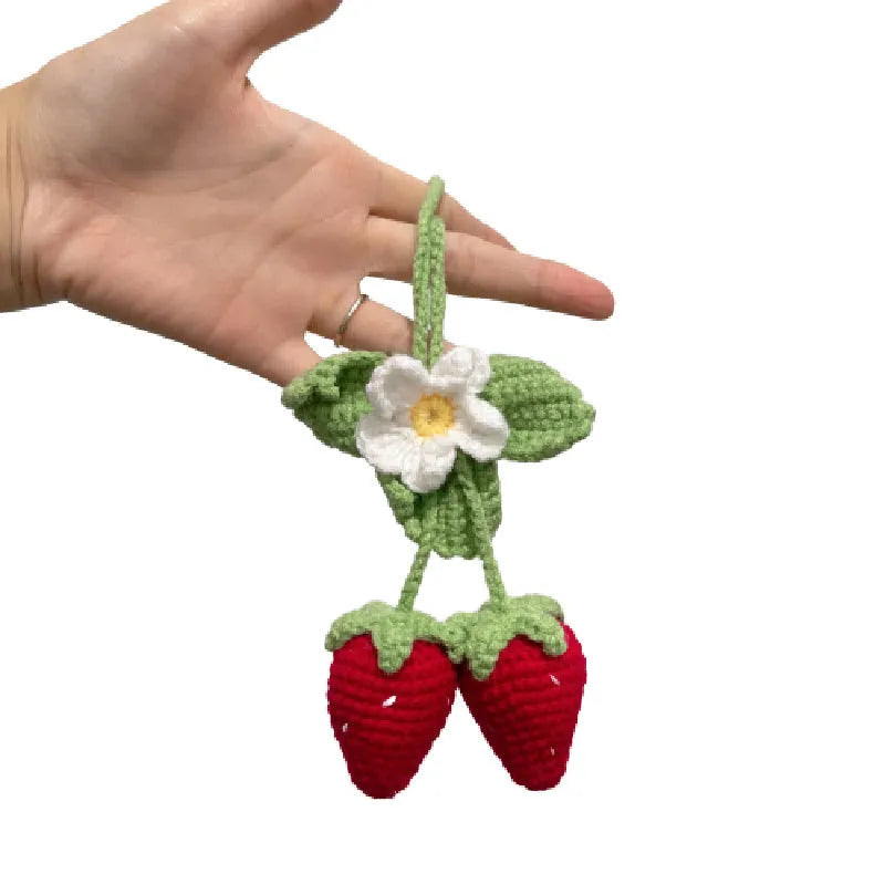 Handmade strawberry-shaped weaving pendant for car decoration made of cotton and hemp.