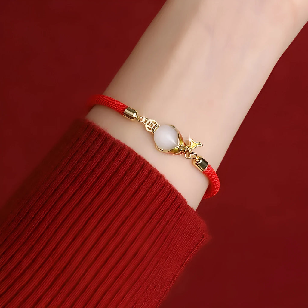 Lucky koi red copper carp literary necklace and retro bracelet on a white background.