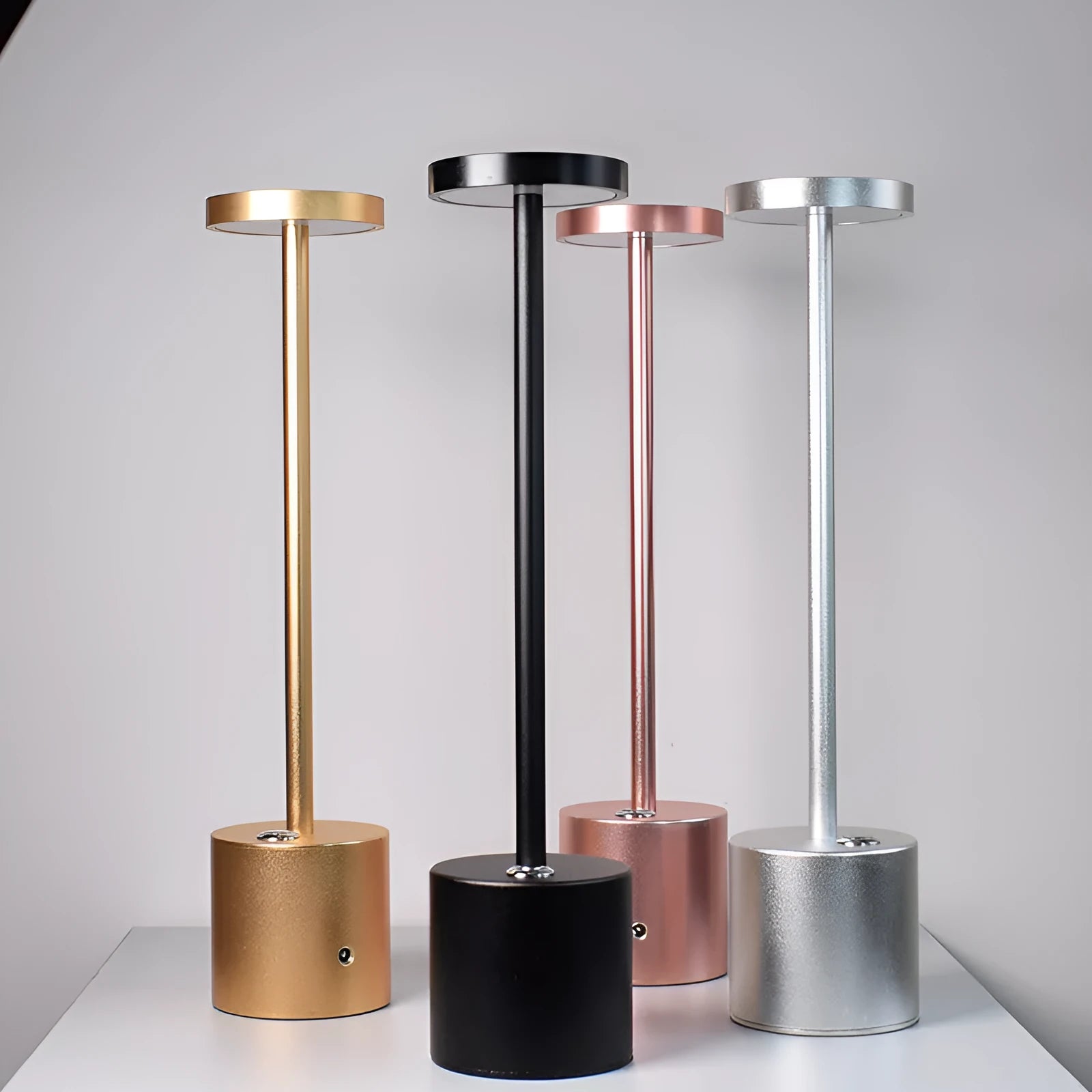 All-aluminium rechargeable LED touch desk lamp in black finish on a wooden desk