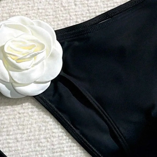 Black women's bikini swimsuit with 3D flower lace detailing and backless split design