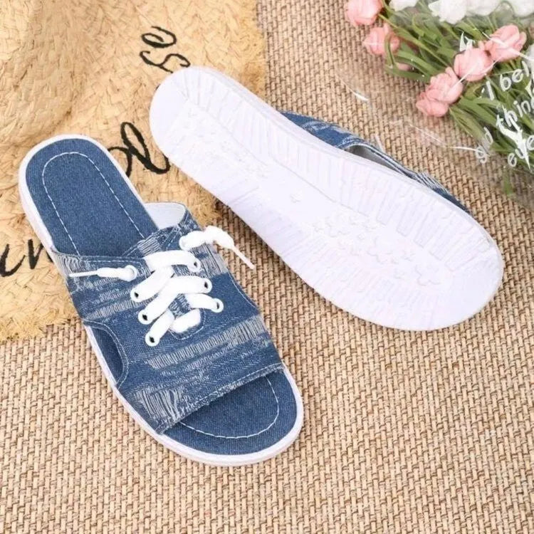 Blue Roman-style women's canvas slippers with flat design and rubber sole