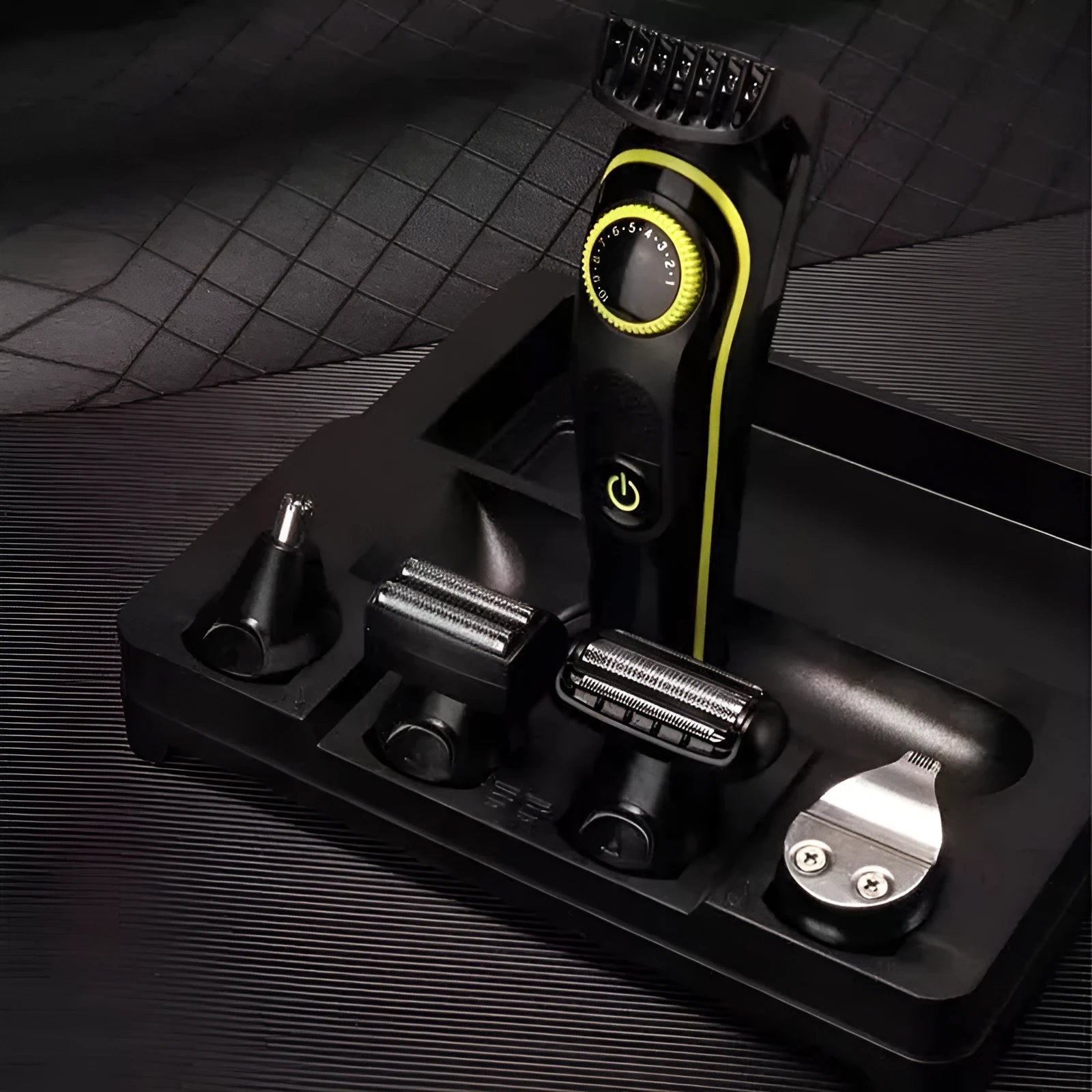 Black KM-696 rechargeable electric hair clipper set with USB cable and cleaning brush.