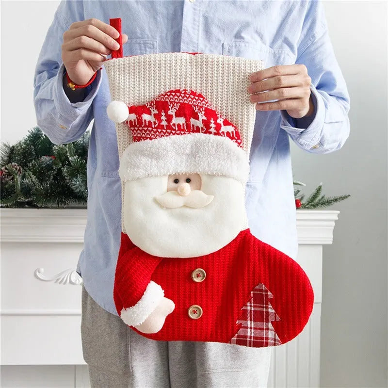 Large red and white knitted Christmas stocking with Santa Claus design for fireplace decoration