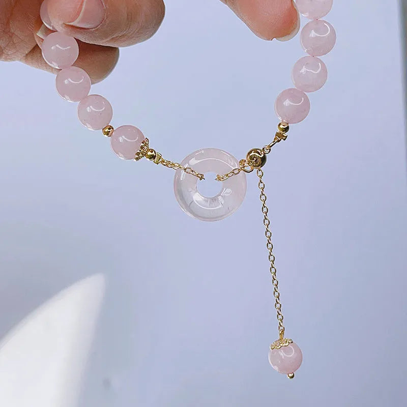 Pink crystal women's bracelet with distinctive peace buckle clasp, simple jewellery design