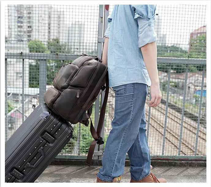 Dark brown Retro Crazy Horse leather backpack for a 17-inch laptop, showing internal organiser pockets.