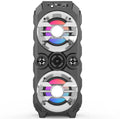 Portable Bluetooth speaker with wireless colour lights and integrated pull rod handle in blue, red, or silver grey