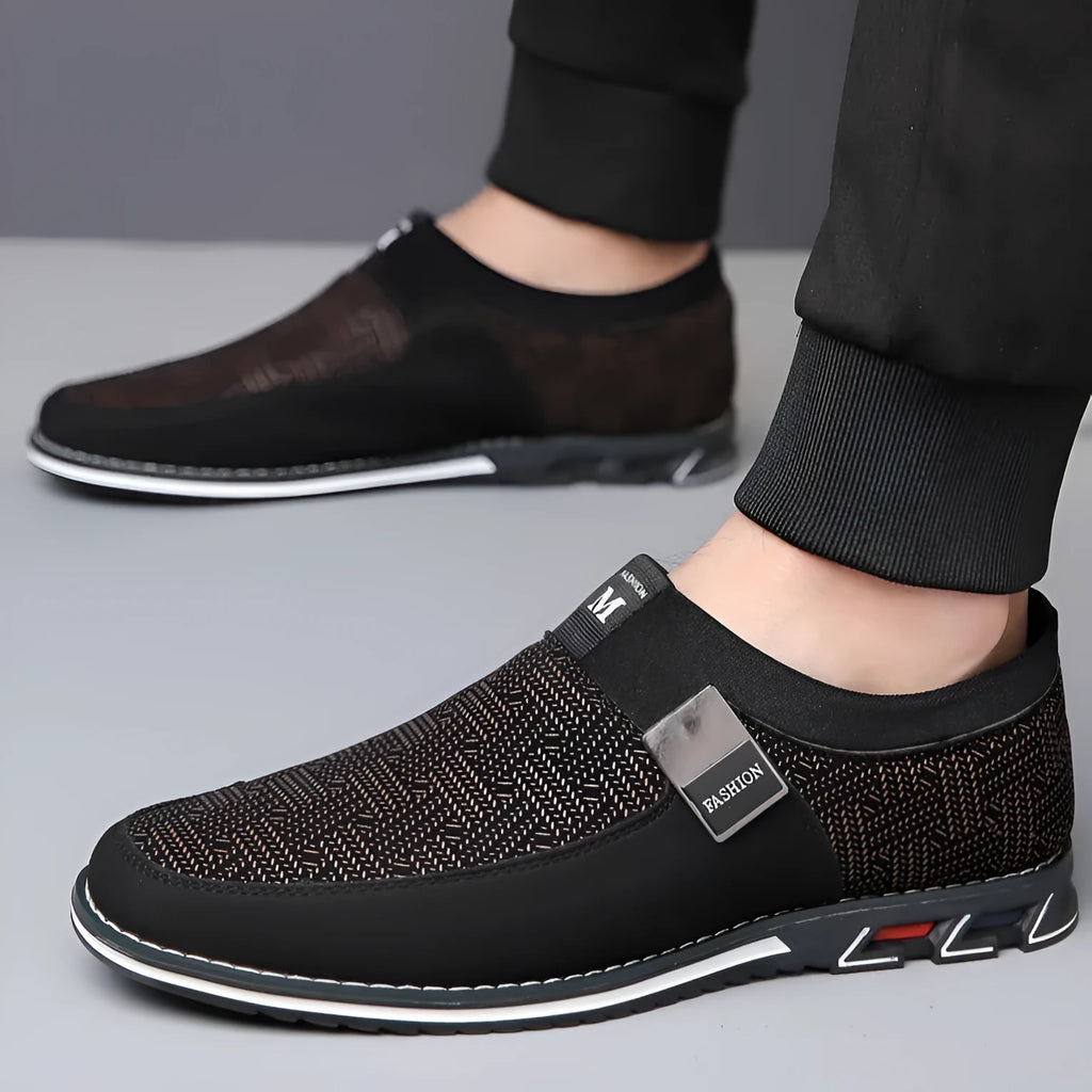 Men's black synthetic leather slip-on casual shoes with a square toe and rubber sole.