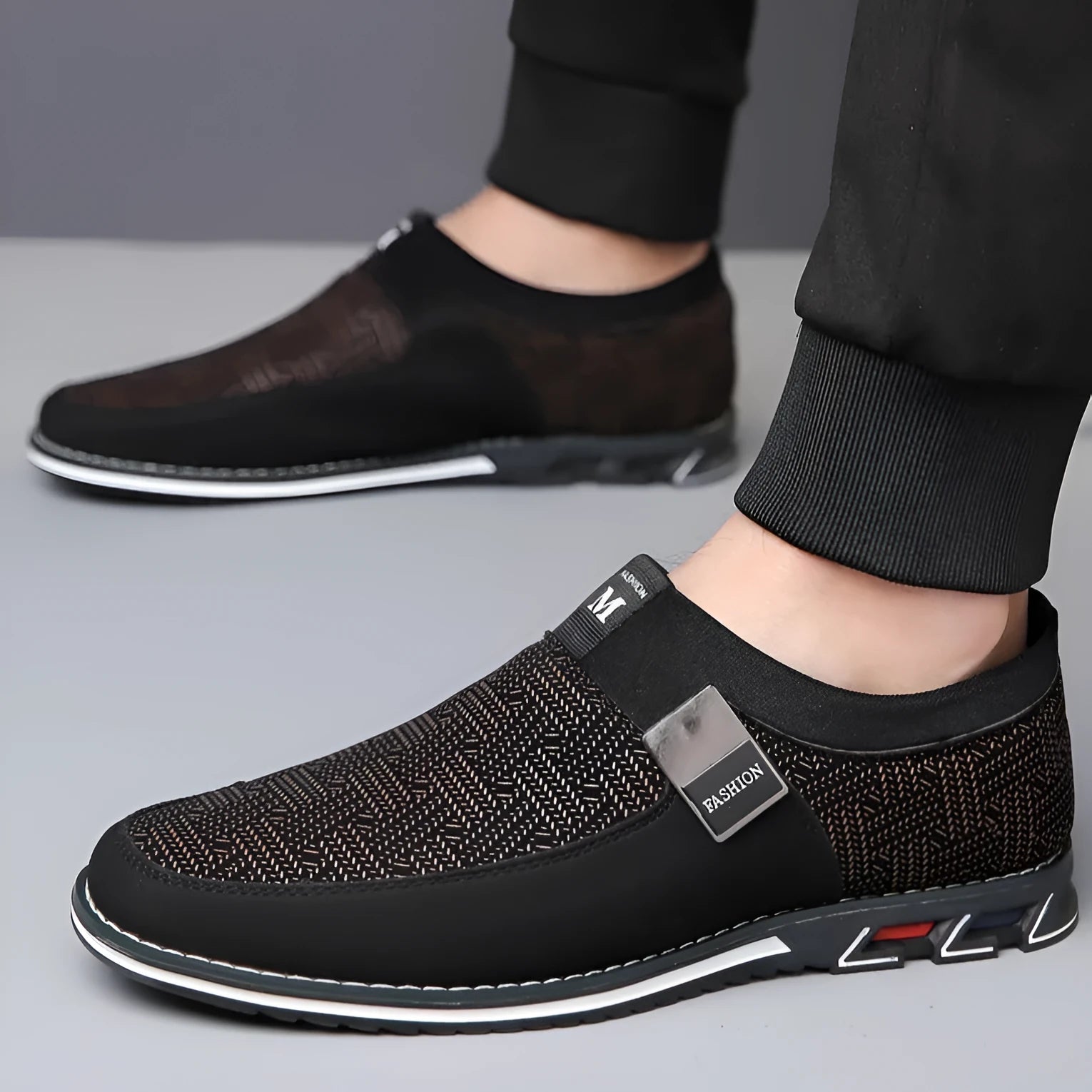 Men's black synthetic leather slip-on casual shoes with a square toe and rubber sole.