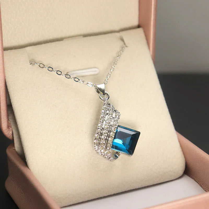 Women's alloy necklace and earring set with glass pendant in European style