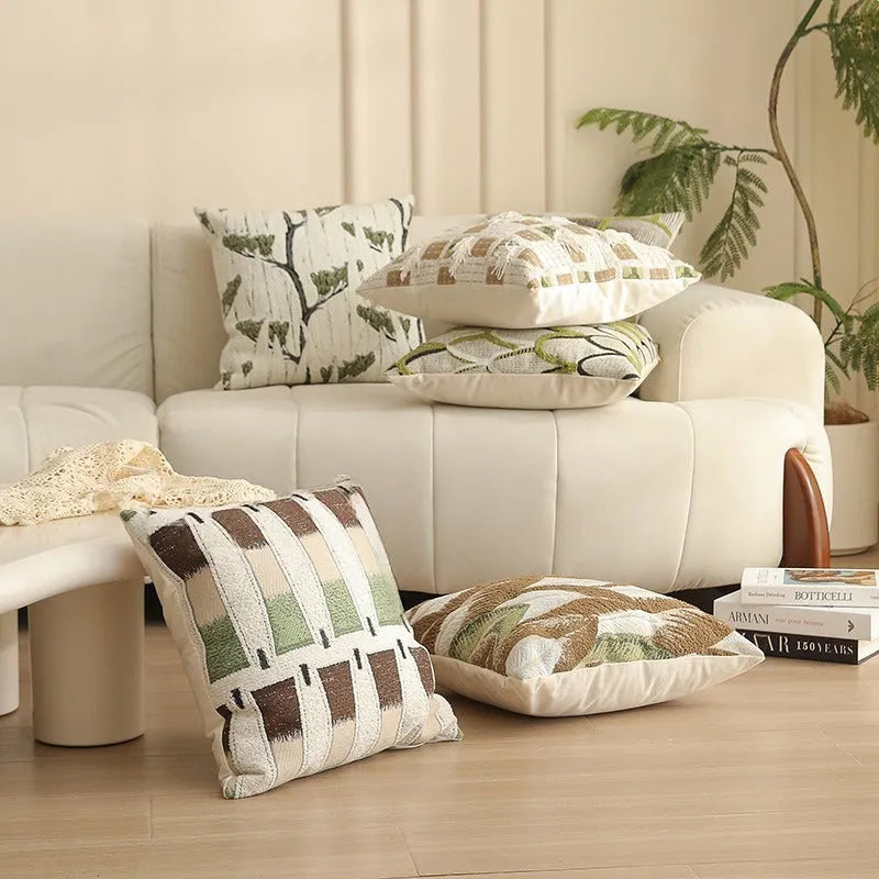 Square 45cm retro jacquard cushion cover with a woven plants and flowers pattern in a Nordic style, shown in one of eight available colours.