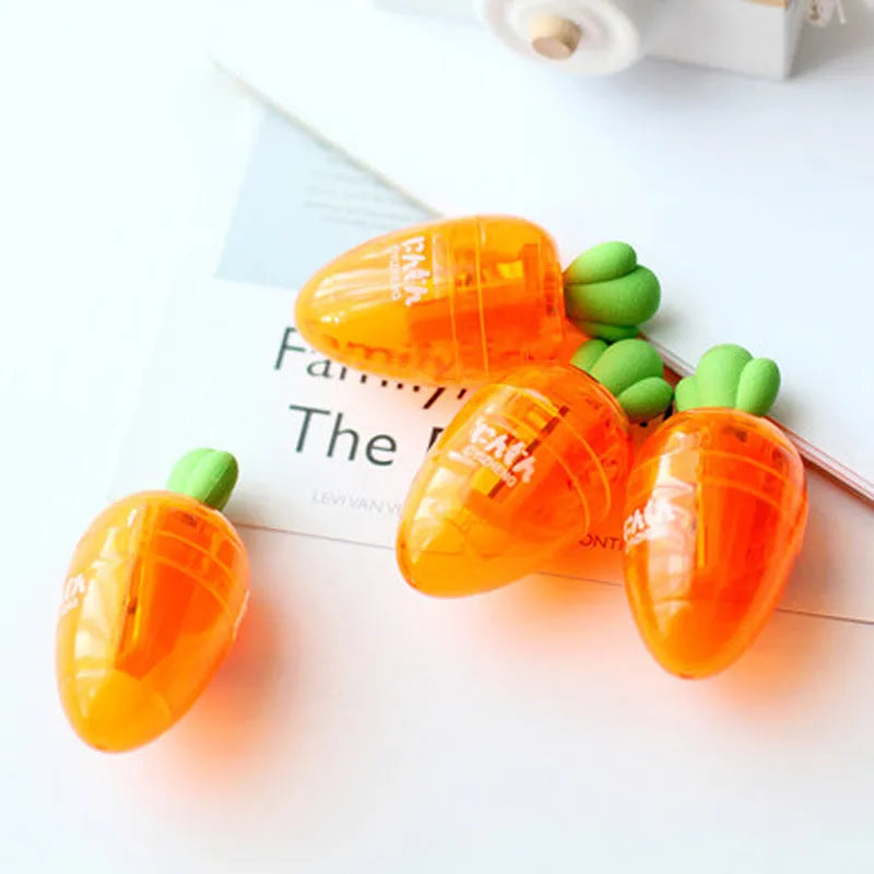 Carrot-shaped plastic manual pencil sharpener with extended handle on a white background.