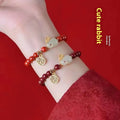 Cinnabar hare bracelet in purple gold sand colour with traditional bead design