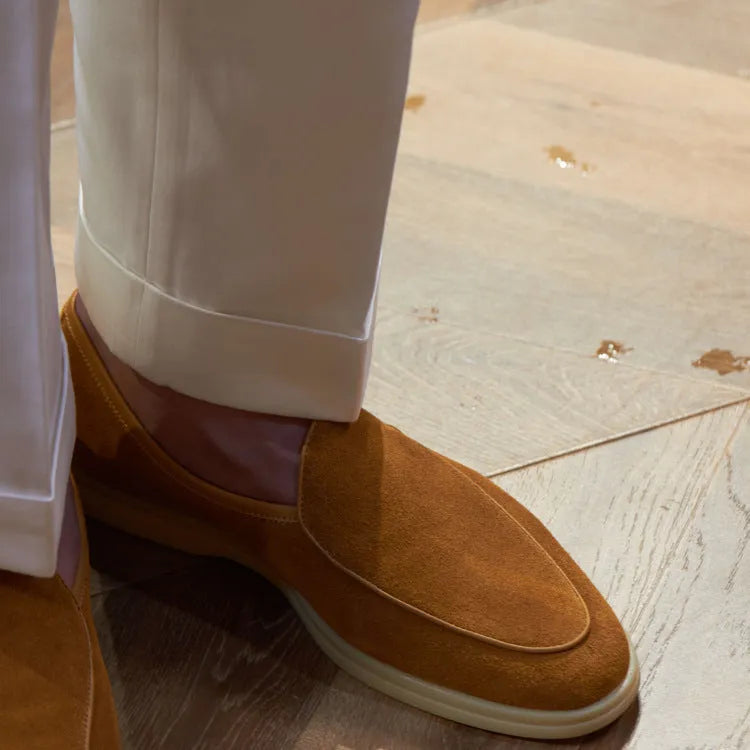 British handmade men's genuine leather loafers in various colours on a flat shoe sole.