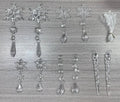 Set of ten clear acrylic icicle and snowflake Christmas ornaments with white hanging ribbons.