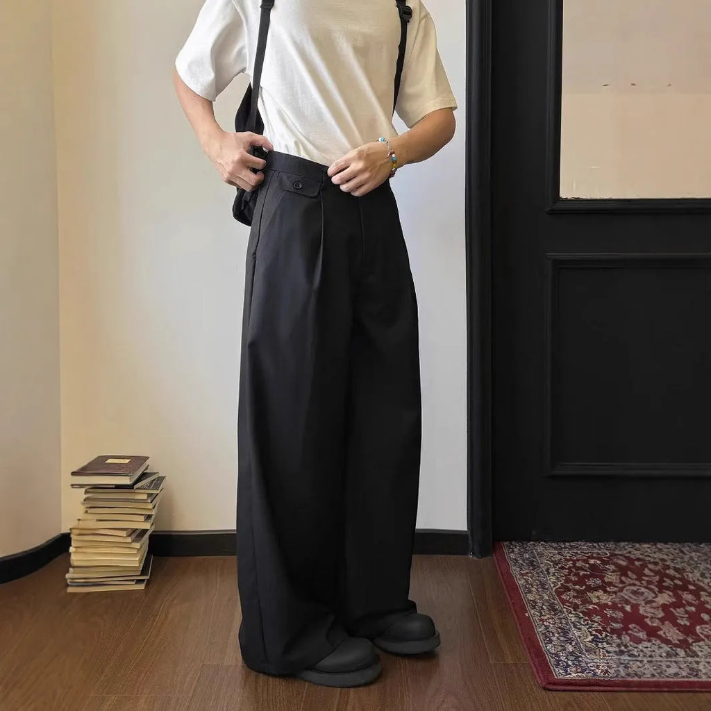 Brown men's wide-leg straight trousers with a draping casual suit style on a hanger.