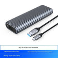 Aluminium external SSD enclosure for M.2 drives with included USB-C cable, heat vest, and thermal paste.