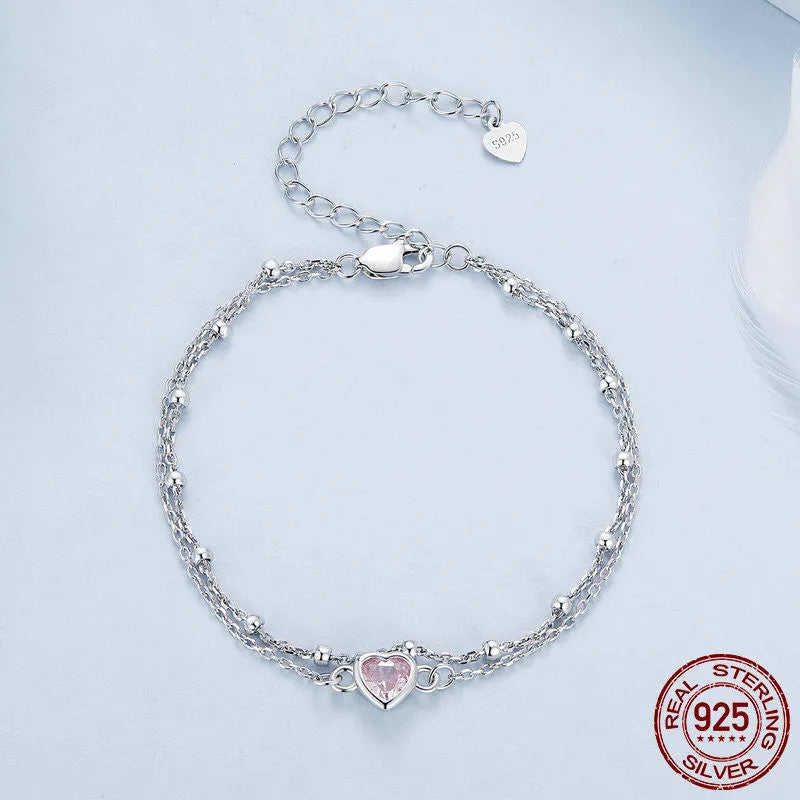 Women's sweet style 925 sterling silver bracelet with small heart charm on an adjustable chain.