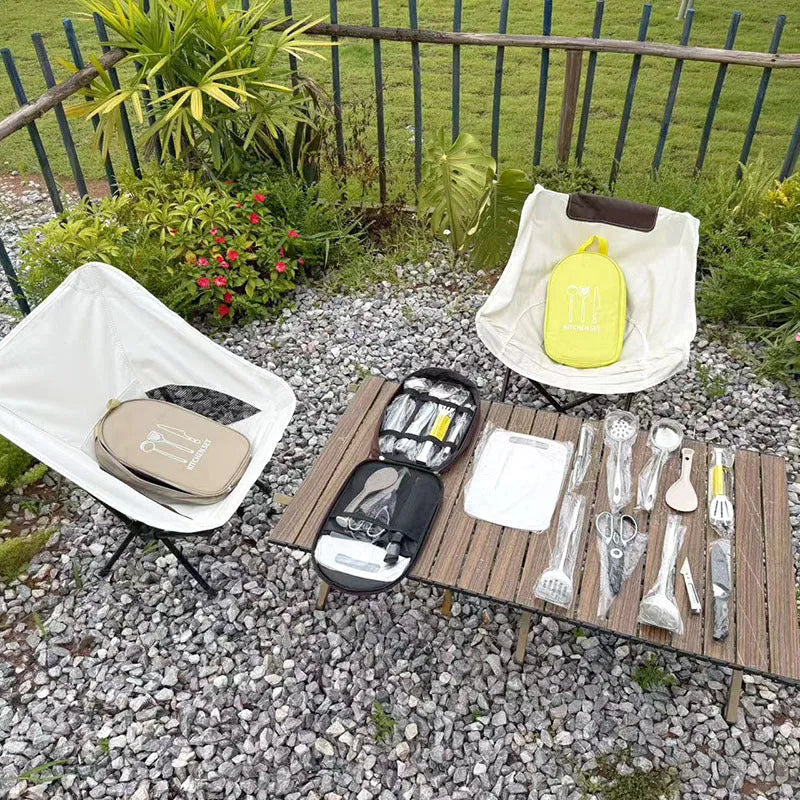 12-piece stainless steel picnic kitchenware set with khaki storage bag open to show utensils
