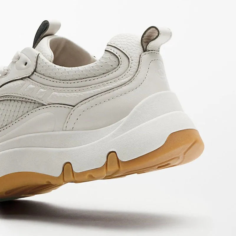 Women's beige off white round toe sneakers with top layer cowhide upper, cross straps, and thick sole