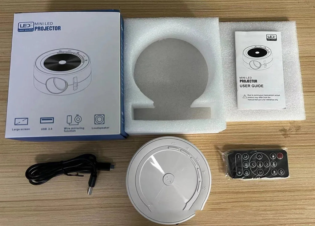 YT200 portable LED projector in black, white, yellow and white, or blue and white colours with remote control