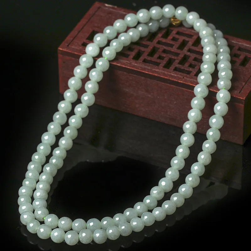 Natural jade bead necklace with round white and green beads on adjustable chain
