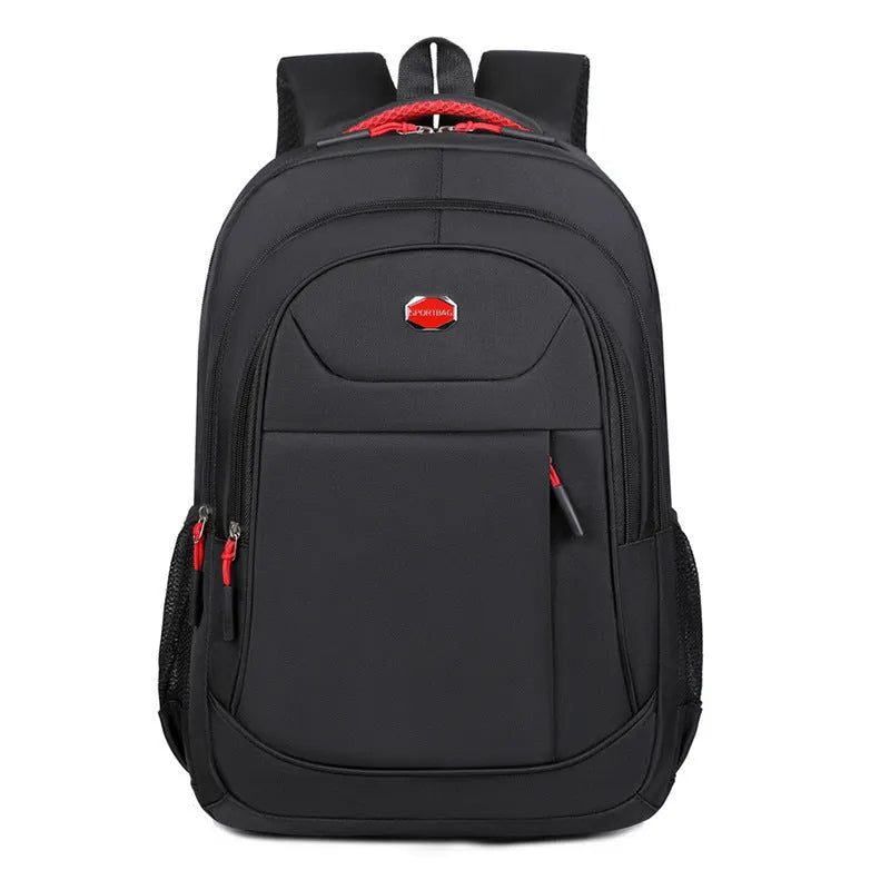 Black Oxford cloth multi-layer student backpack with curved shoulder straps, shown with compartments open.