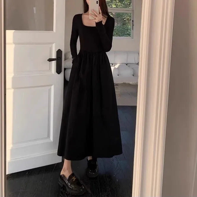 Black square collar long sleeve knitted dress with elastic waist and A-line skirt.