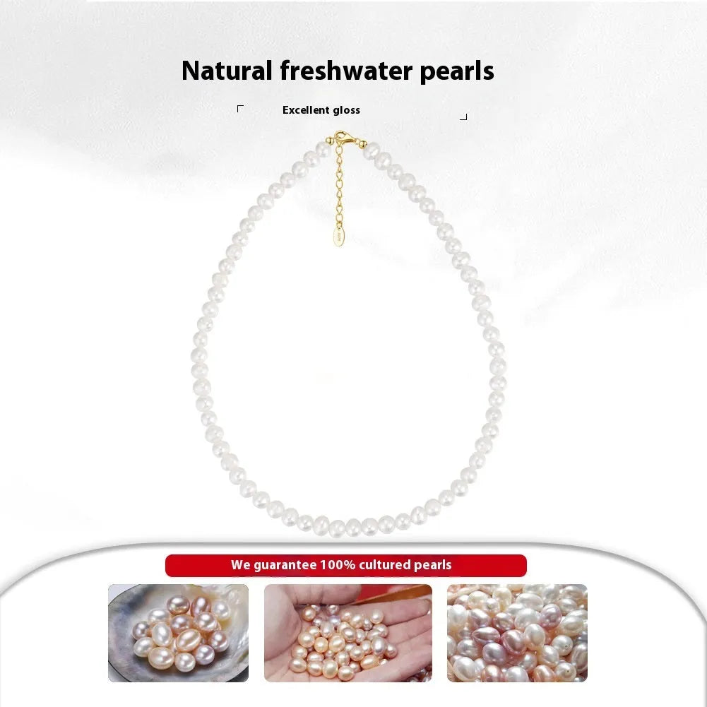 Women's silver necklace with round freshwater pearls on an adjustable chain.