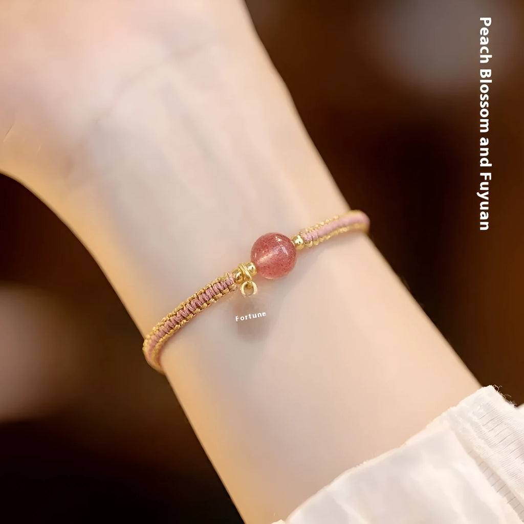 Adjustable red rope bracelet with strawberry quartz transfer beads and sliding knot closure