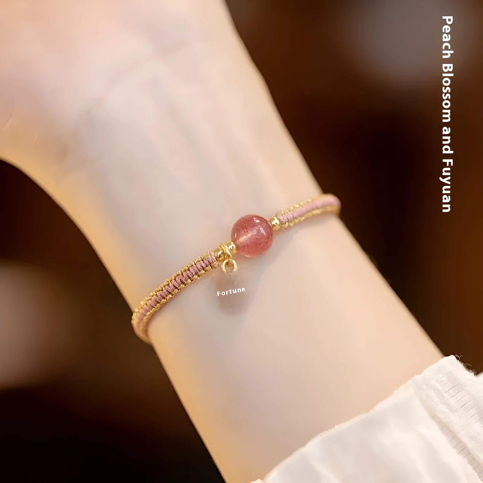 Adjustable red rope bracelet with strawberry quartz transfer beads and sliding knot closure