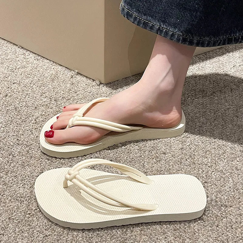 Men's PVC flip flops in beige with a non-slip sole and toe-covering style.