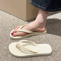 Men's PVC flip flops in beige with a non-slip sole and toe-covering style.