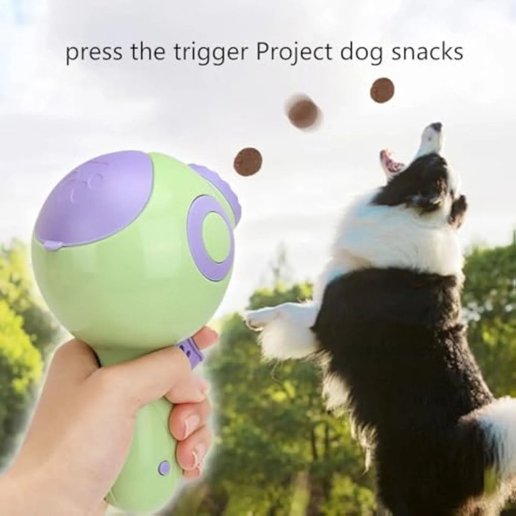 Green dog treat launcher toy with food dispenser mechanism for interactive pet play
