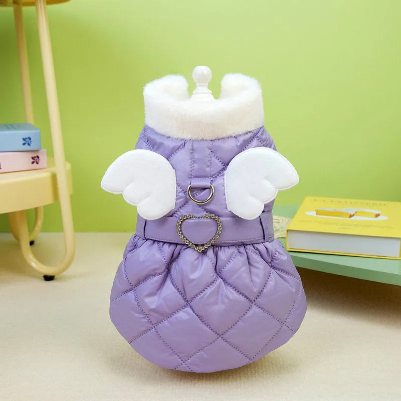 Small dog wearing pink angel design skirt with adjustable belly strap