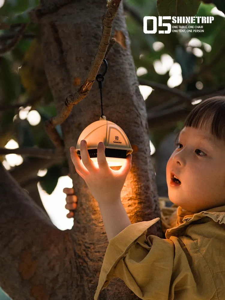 Dark green camping tent light with analog brightness dial, shown at 10.5cm tall.