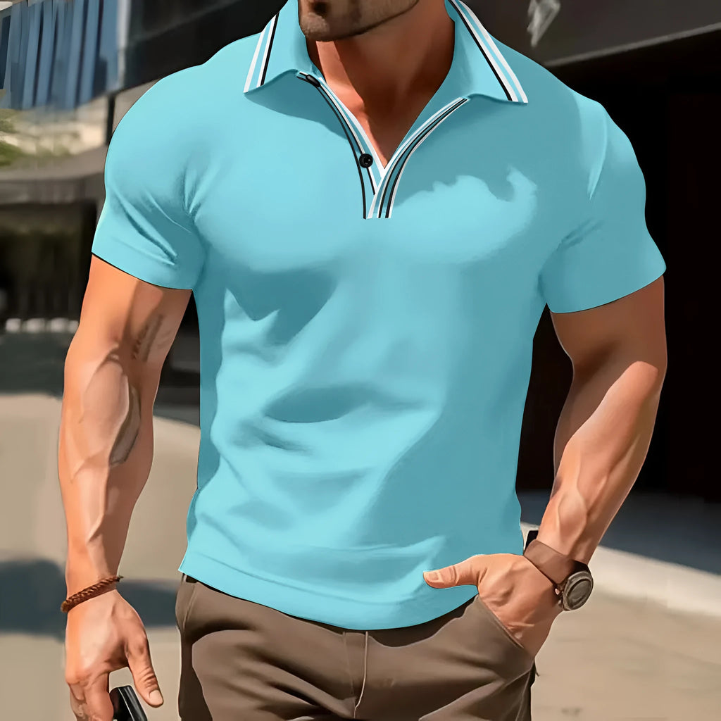 Man wearing a loose-fit striped short-sleeved t-shirt in a summer setting.