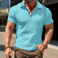Man wearing a loose-fit striped short-sleeved t-shirt in a summer setting.