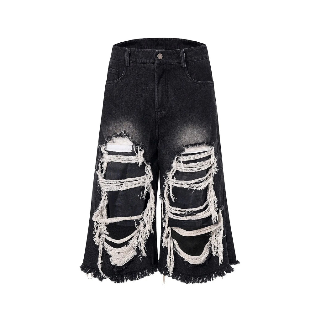 Black women's cropped wide-leg jeans with ripped patch detail and a mid-high waist