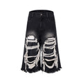 Black women's cropped wide-leg jeans with ripped patch detail and a mid-high waist