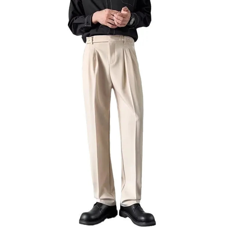 Men's apricot and black straight-leg loose fit suit trousers made from polyester fabric.