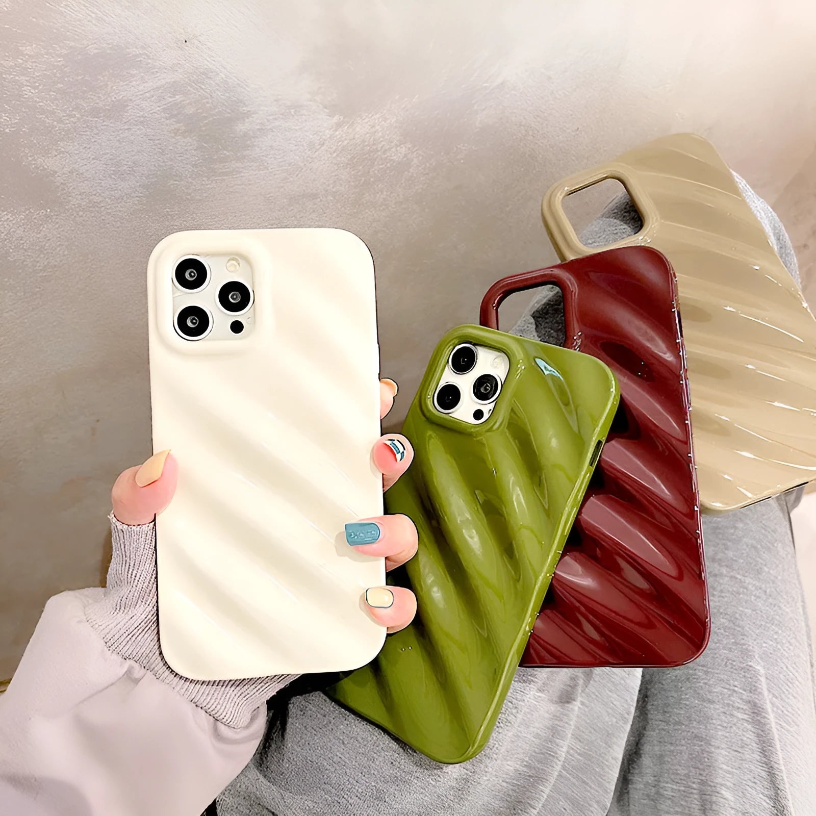 Nordic style pleated silicone iPhone case in silver with laser etching detail.