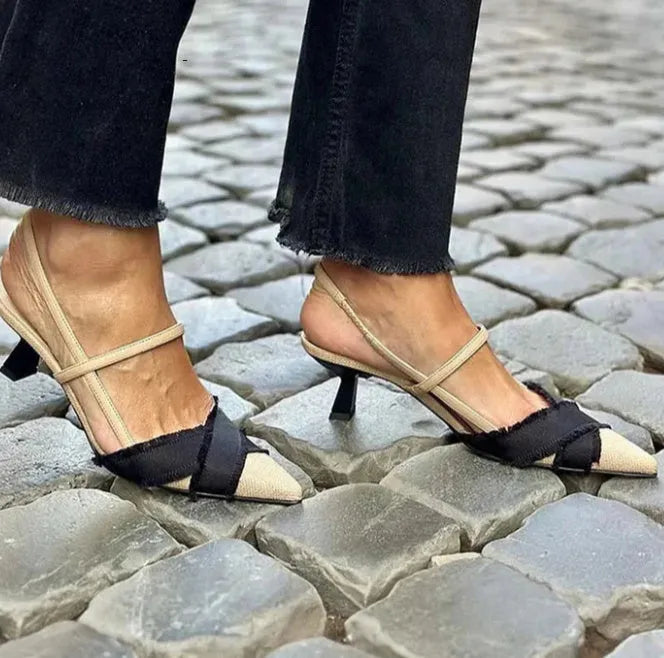 Apricot and black colour block women's stiletto sandals with a buckle strap and pointed toe.