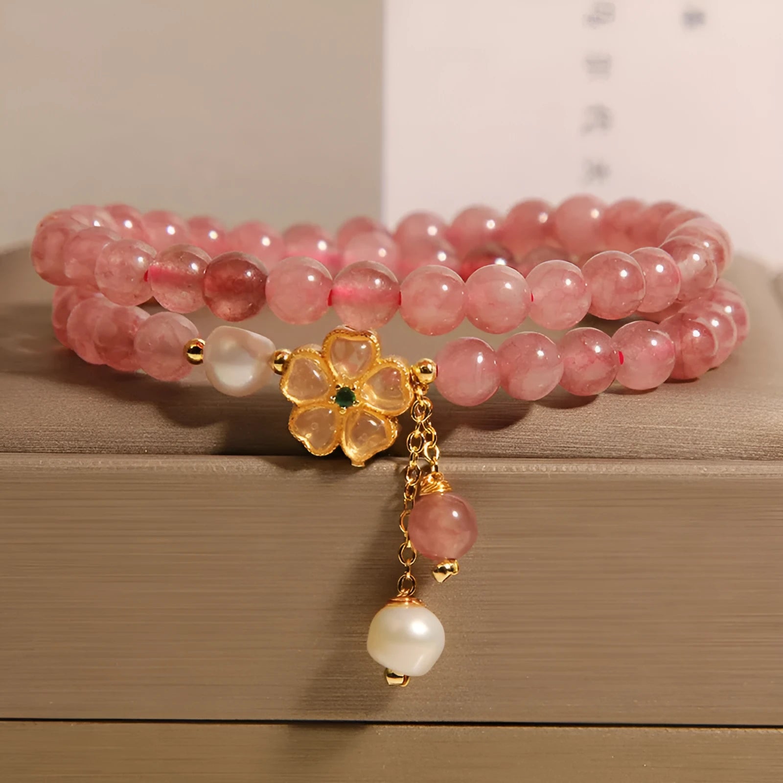 Women's double ring bracelet with strawberry quartz four-leaf clover design in Japanese Korean jewellery style