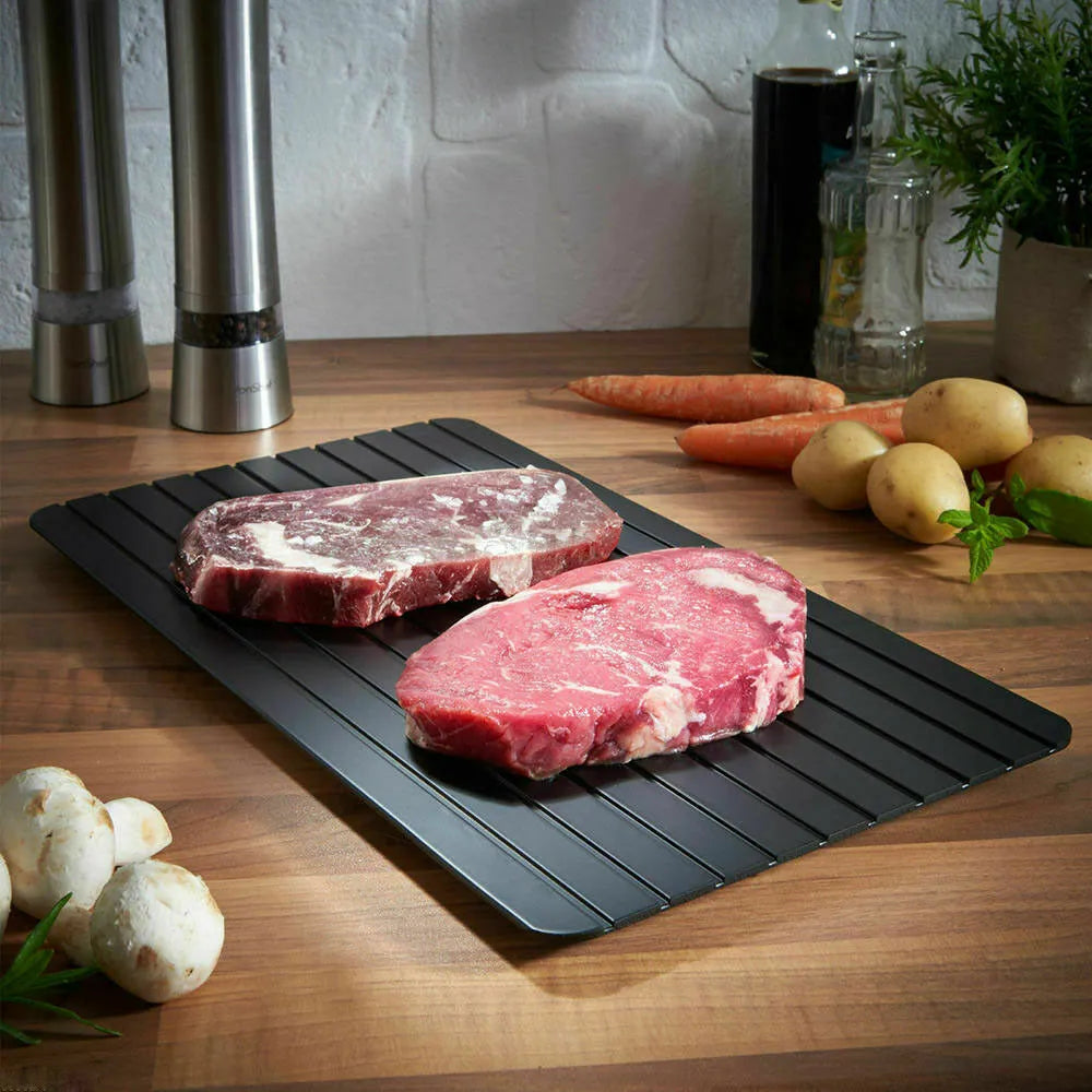 Black aluminium fast defrosting tray for kitchen use measuring approximately 23cm by 16.5cm