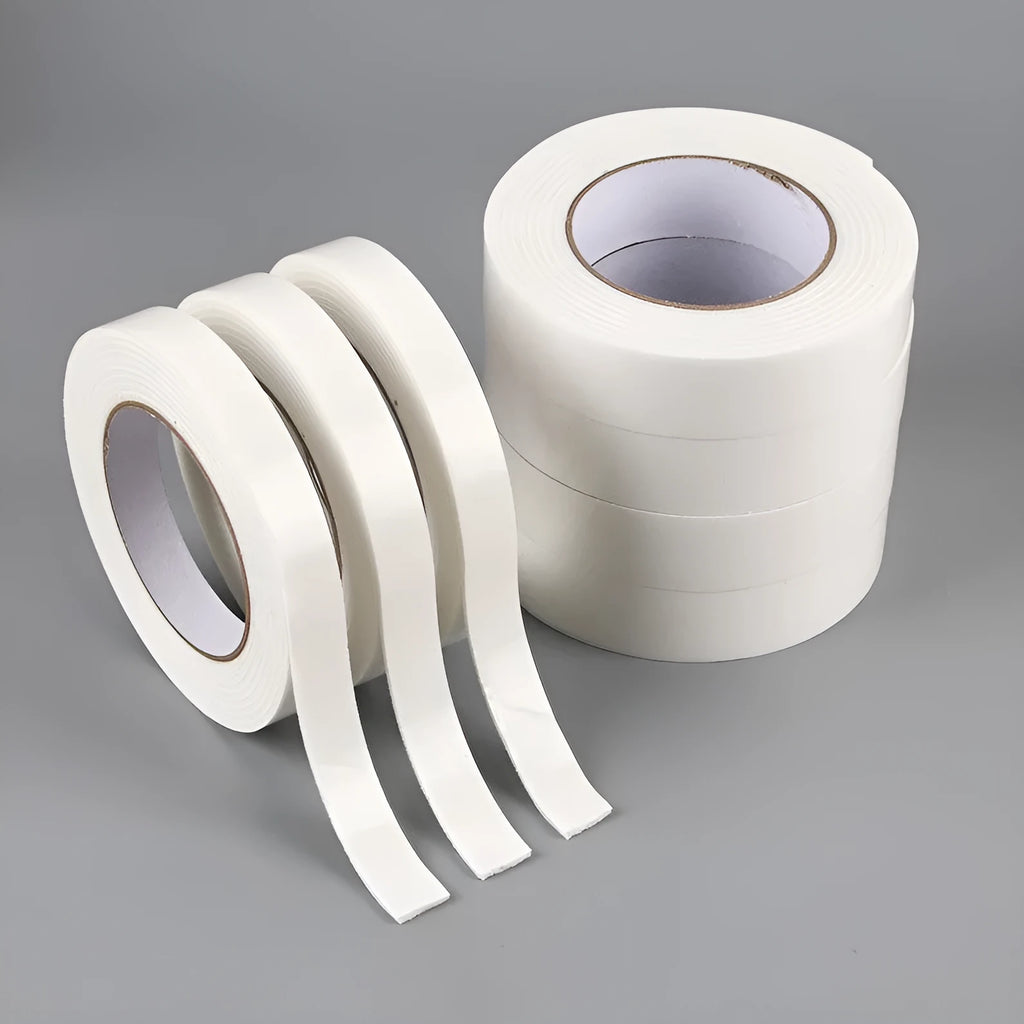 Roll of 3mm thick white foam double-sided adhesive tape showing its spongy core and strong adhesive on both sides.