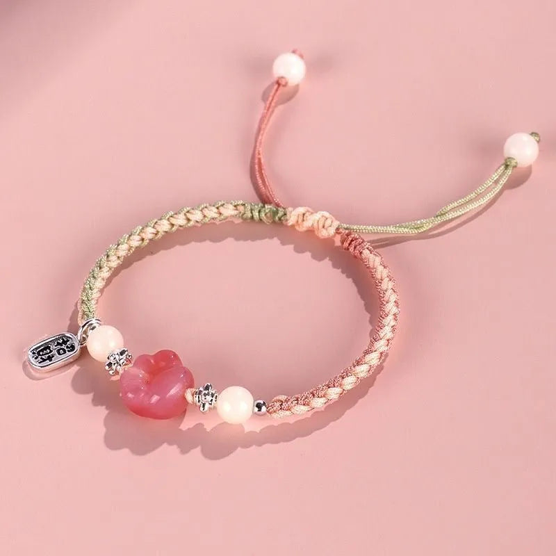 Red cat's paw charm couple bracelet in pastoral woven style with pink or yellow options