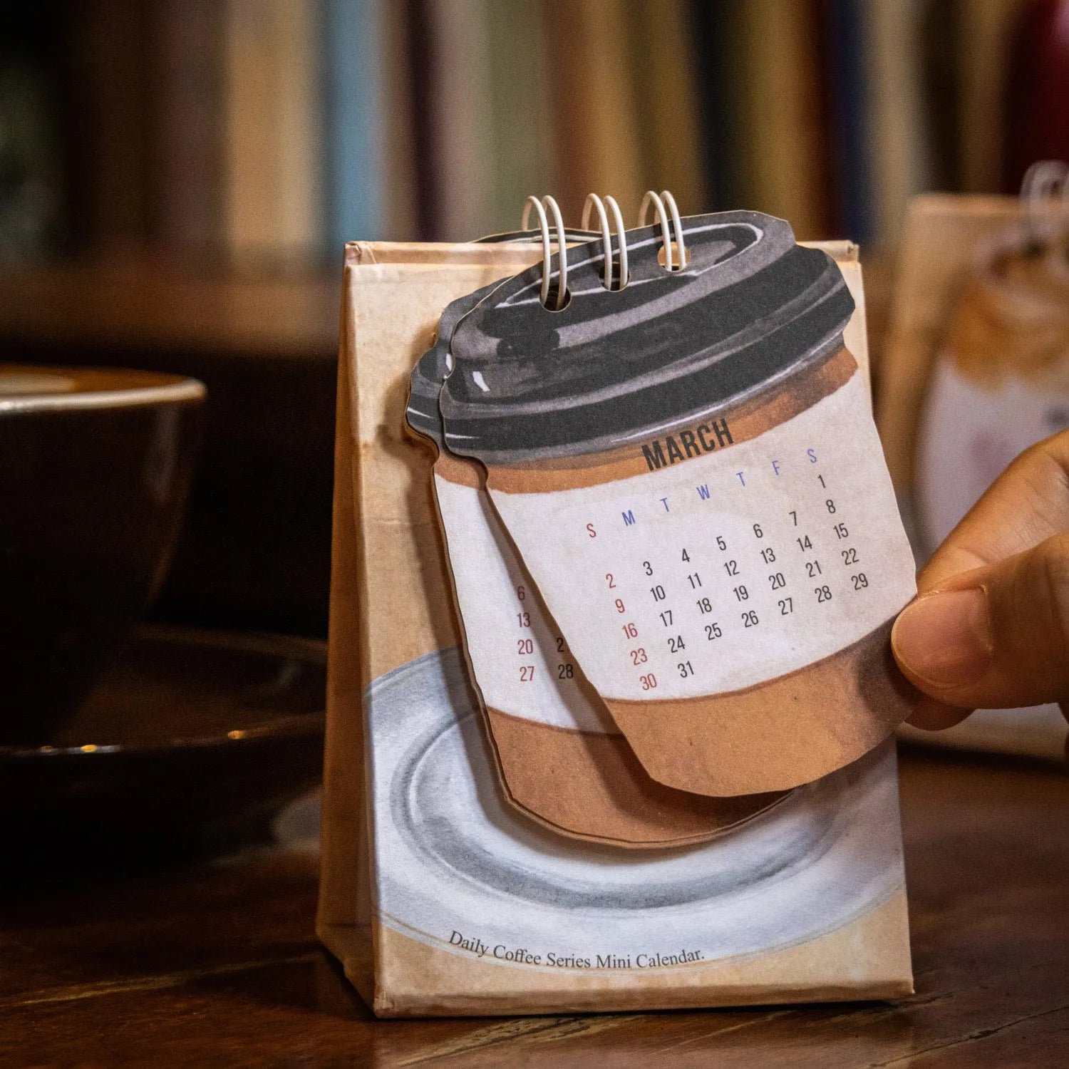 Coffee Coffee mini desk calendar set showing four 2025 paper calendars with different themes for daily inspiration