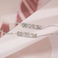 Stainless steel digital bracelet with diamond-set number display on wrist.